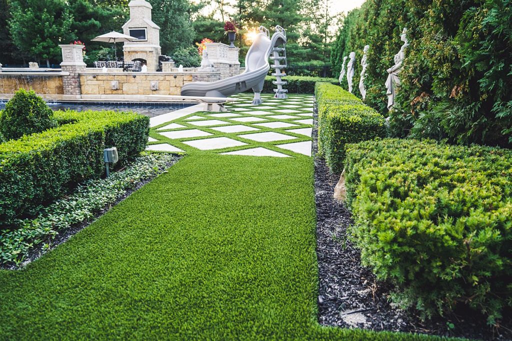 Backyard Pool Landscape Design with Artificial Grass from GroTurf, Inc.